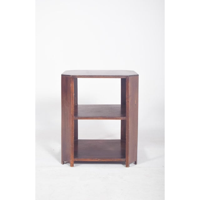 Deco coffee table in walnut. With three planes and a hexagonal structure with smoothly cut corners, a flat, smooth top...