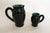 Pair of mid-century pitchers, with attractive twisted/braided handles in relief, one large (H 17 cm x 15 cm x 10 cm) and...