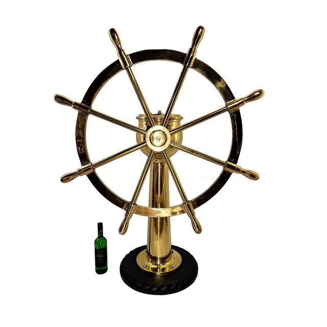 Very impressive eight spoke ships wheel mounted to a geared pedestal. The pedestal head is engraved Dake Engine Company,...