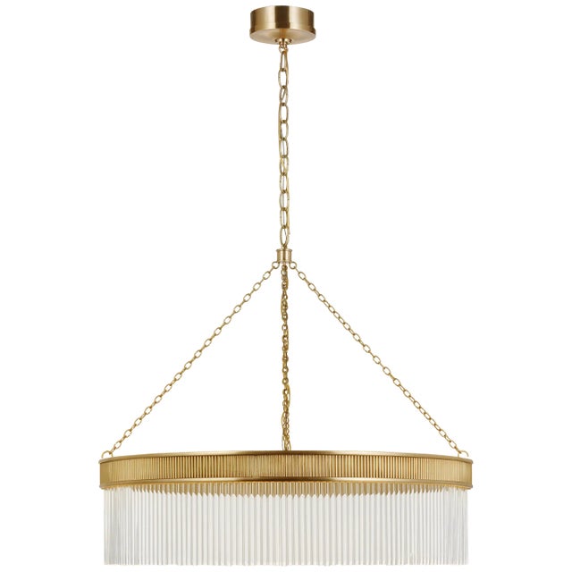 Menil Large Chandelier in Soft Brass with Crystal Rods Designer: Marie Flanigan Canopy: 6" Round Mounting: Chain Shade...