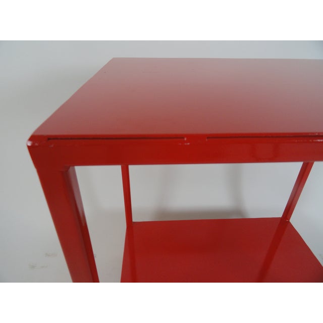 CUSTOM TABLE In the manner of Billy Baldwin custom-made metal side table. Two tiers. Made of Steel. Red finish. Custom!...