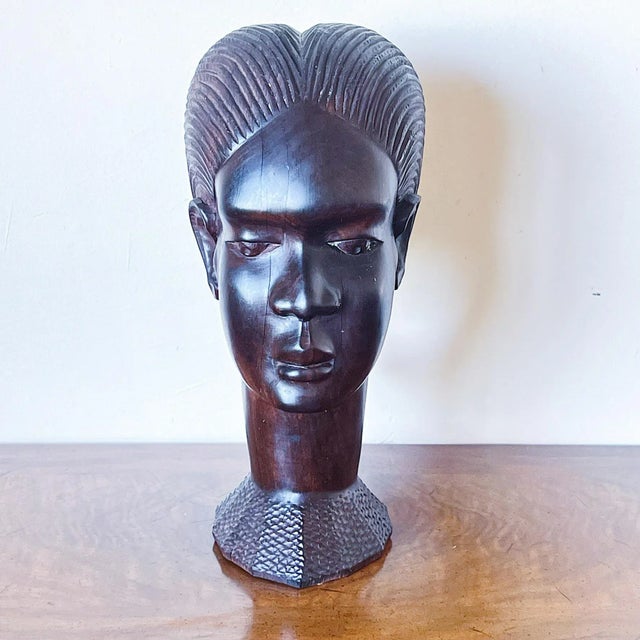 Early 20th Century Large Hand-Carved Bust of African Woman in Wood Expertly carved braids joining behind the back of head...