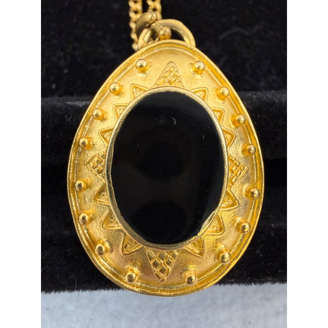 Leslie Block vintage Etruscan Revival style necklace with pendant and matching clip earrings. The chain is 32”, and the...