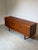 Refined mid-century modern sideboard by White & Newton , crafted in beautifully grained teak wood and raised on elegant...