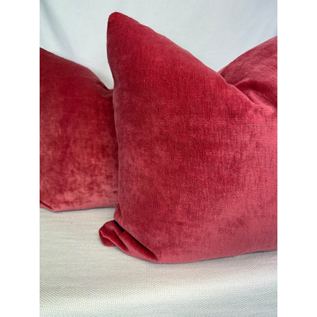 Custom pair of 22" pillows covered in a raspberry pink linen velvet. These pillows have tapered corners to prevent dog...