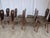 Vintage wooden dining chairs made in Yugoslavia, circa 1960s–1970s. The chairs feature a charming rustic folk design with...