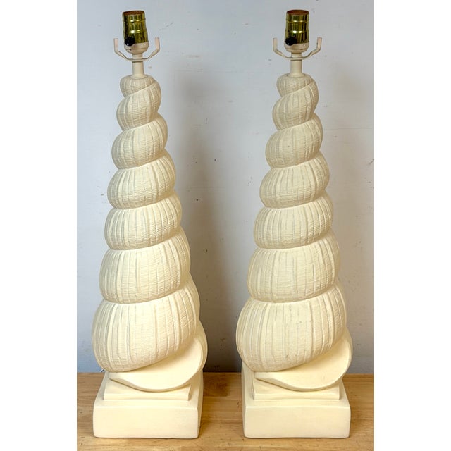 Pair of Hollywood Regency Spiral Seashell Form Plaster Table Lamps A striking pair of Hollywood Regency table lamps...