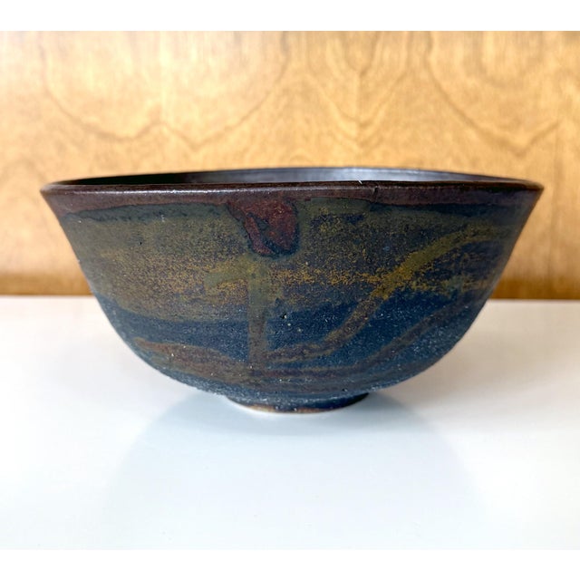 A large ceramic bowl (Chawan) by Japanese American artist Toshiko Takaezu (American, 1922 - 2011). The deep form bowl...