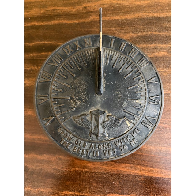 A stunning vintage iron garden sundial reading "Grow old along with me. The best is yet to be." USA, Late 20th Century...