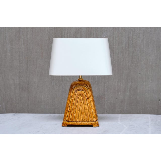 This rare table lamp was designed by Gunnar Nylund and produced by Rörstrand in Sweden in the 1950s. The base is impressed...