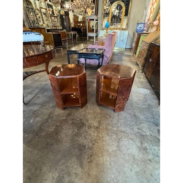 This product is a pair of Italian Art Deco design burlwood side tables, featuring a beautiful polished finish. These...