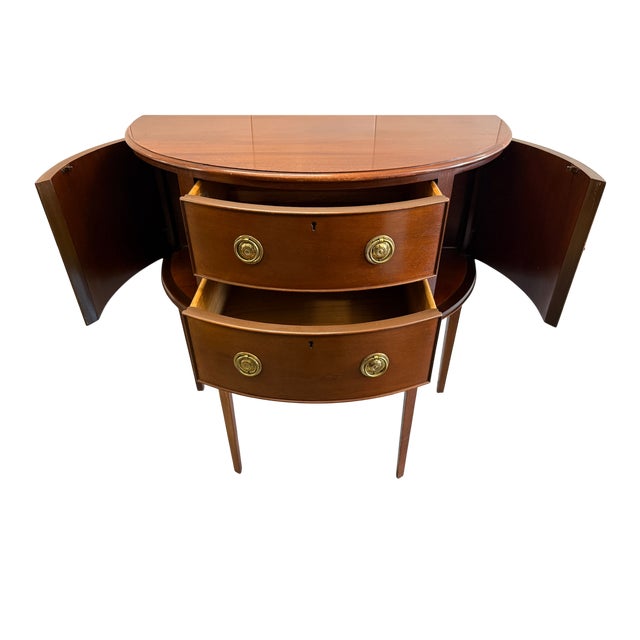 Baker Furniture Historic Charleston Mahogany Demilune Cabinet or Sideboard This beautiful piece has 4 tapered legs that...