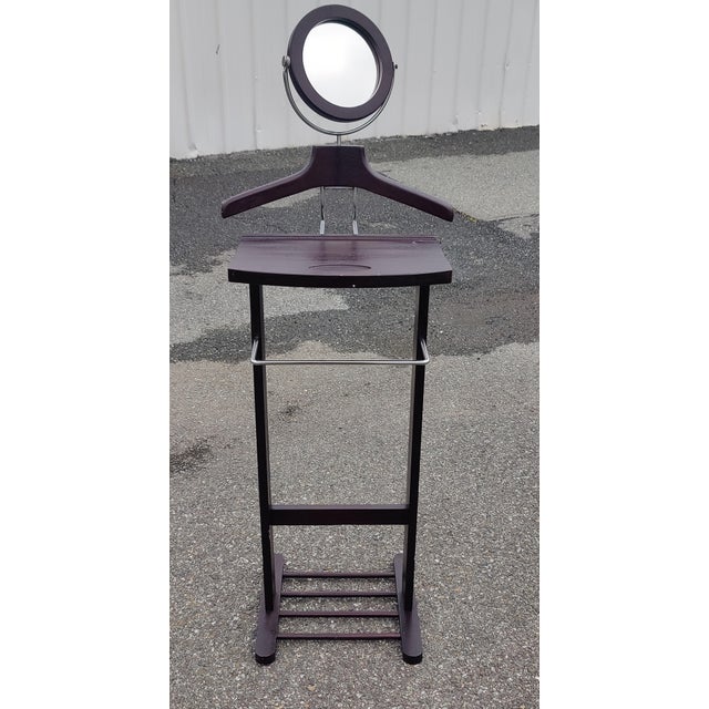 An elegant and functional Art Deco-inspired valet stand crafted from black lacquered wood, this piece offers comprehensive...