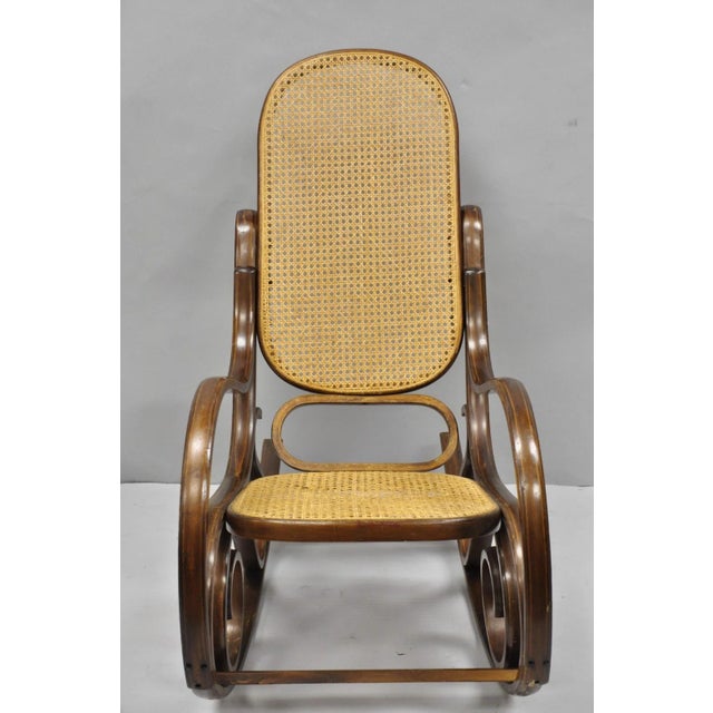 Vintage Mid Century Modern Thonet Style Bentwood & Cane Rocker Rocking Chair (C). Circa Mid 20th Century. Measurements:...