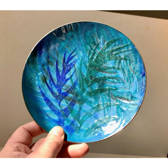 Decorative art dish in copper with applied enamel. Abstract slightly raised leaf-like motifs. It is signed K. K. Worz and...