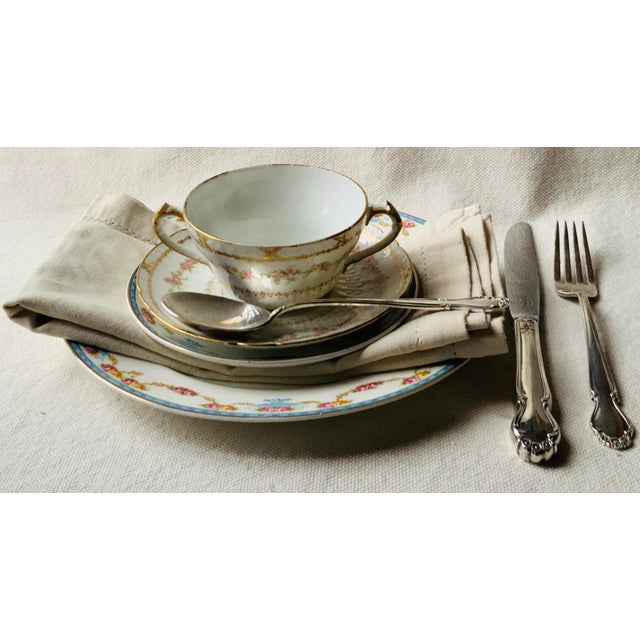 …What a charming pair these are—two elegant French Limoges porcelain soup bowls, each with its own underliner, recently...