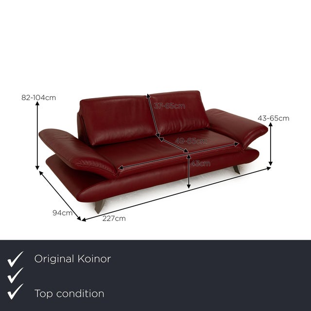 The Velluti sofa from Koinor is covered with a red real leather and stands on narrow metal feet. The classic design and...