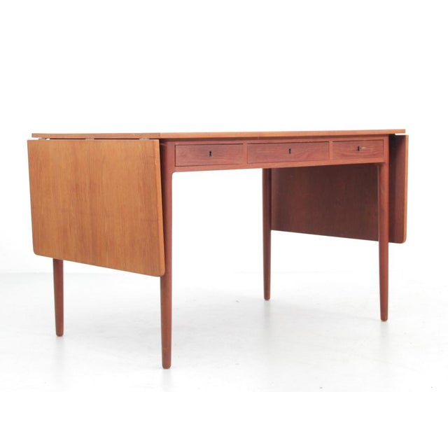 Scandinavian Teak Desk with 2 Flaps attributed to Hans Wegner, 1950s, in Very Good conditions. Designed 1950 to 1959