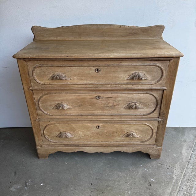Newly refinished antique pine chest of drawers having three drawers with ornate handles. Chest height to its top is 34.5 H