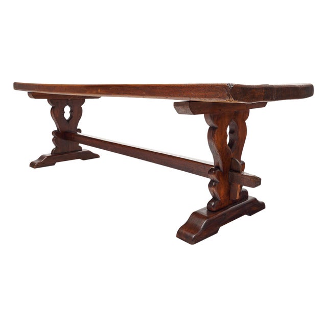 French dining room table made of solid oak and finished with a lustrous wax polish. The two hand carved pedestals are...