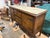 Beautiful antique marble-top sideboard, featuring burlwood veneer panels and a thick polished marble slab with striking...