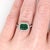 This classic NNJ ring design features a 1.21 carat east west emerald gemstone with natural earth-mined diamonds all set in...