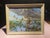 Vintage Paint-by-numbers artwork featuring a duck hunting scene, with a hunter in a rowboat on a lake and ducks in flight....