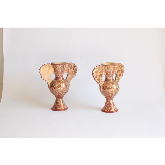A pair of Hispano Moresque style copper lustre vases. Of Alhambra shape. Late 19th. One has a mark underneath "FY" or "TY"