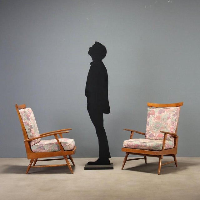 Two reclining armchairs from the 1950s crafted by Camea, identifiable by the branded mark. The structure is wooden with...