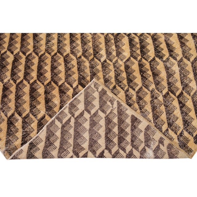 Beautiful vintage Turkish hand-knotted wool rug with a tan field. This Turkish rug has brown accents a gorgeous all-over...