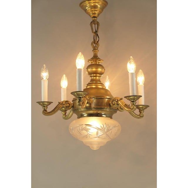 Chandelier with 7 light sources. the glass shade is made of deep-cut lead crystal the lamp is in its original condition,...