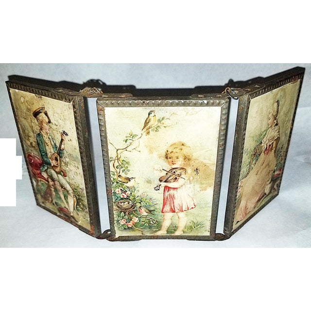 Here's a lovely antique 20th c. 4 way folding triptych mirror with romantic 18th c. style enamel scenes on reverso. Can...
