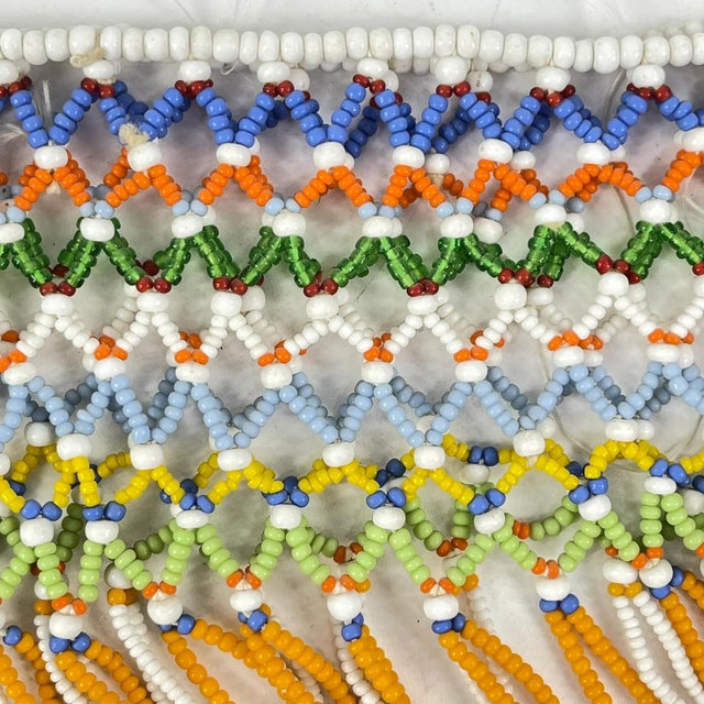 A vibrant example of southern African beadwork tradition, this Zulu-style beaded skirt features hand-applied glass beads...