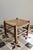 Low stool with a wooden frame and a beautiful herringbone-woven straw seat. Its simple shape and thick legs give it an...