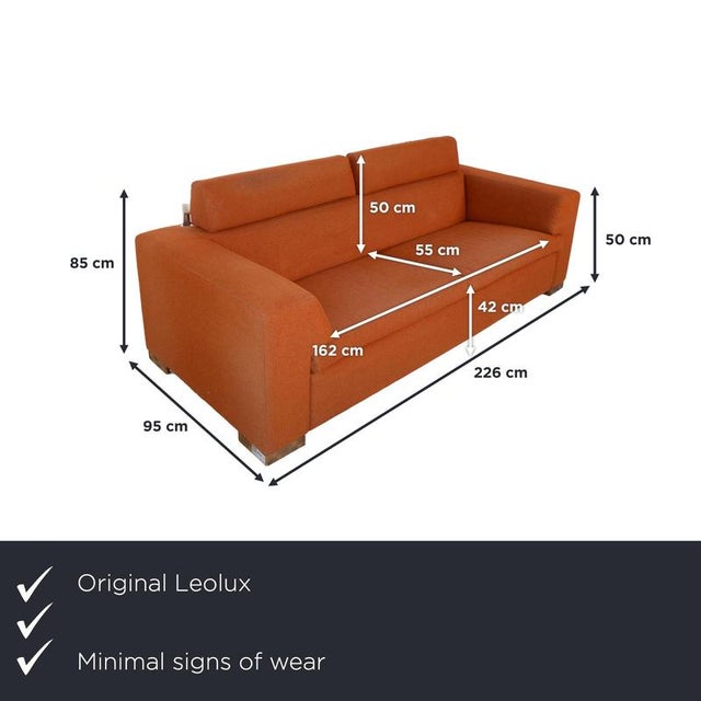 with this Leolux two-seater sofa, you get a sofa with a clean silhouette and striking, wide armrests. The rich rust orange...