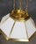 Large Deco inspired hanging chandelier by Ralph Lauren. Milk glass panels set in the geometric shaped hood. Eight medium...