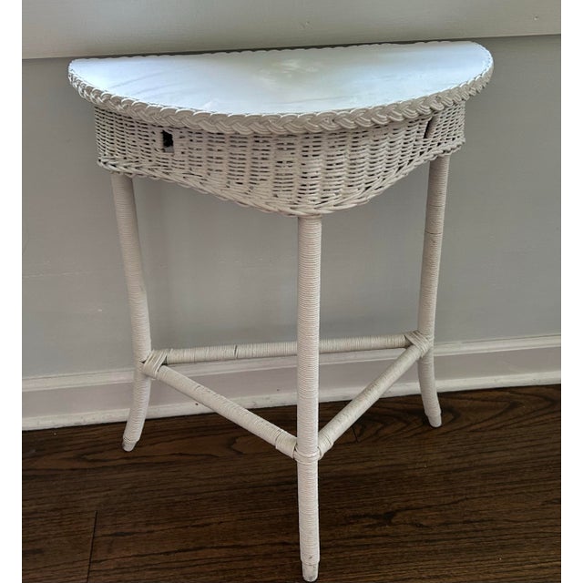 Circa 1900 white wicker Demi Lune table. 21” wide, 11.25” deep, 26.25 tall. Please zoom in on photos. Top little bumpy...