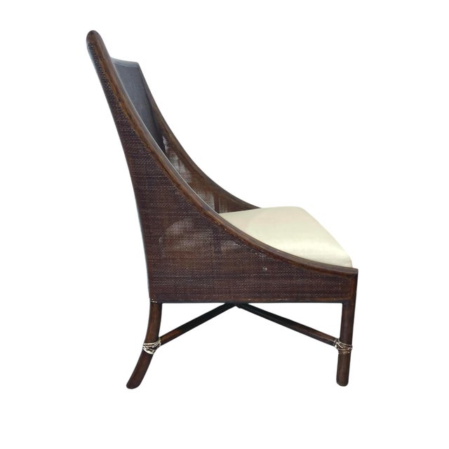 Barbara Barry Petite Caned Arm Chair for McGuire Furniture. Features beautiful caning handsomely framed in rattan and...