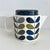 Orla Kiely teapot in Multi Stem pattern in khaki marine print. Complements linear stem pattern inspired by mid-century...