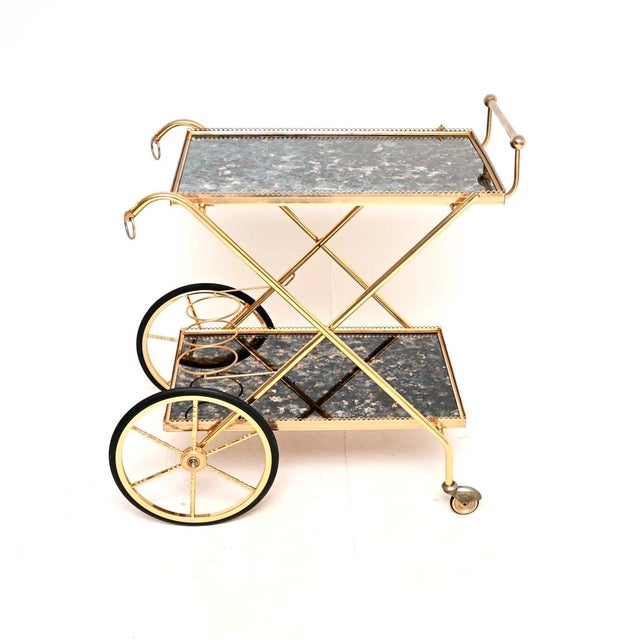 A stylish, beautifully designed vintage Italian brass drinks trolley, dating from the 1970’s. This has a gorgeous design,...