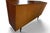 A Danish teak high sideboard by Vejle Stole Møbelfabrik, offering an expansive cabinet form in warm-toned wood. Its long...