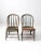 This is a fantastic pair of antique bow back Windsor chairs. The wooden dining chairs feature beautifully curved backs...