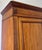 This elegant Antique French wardrobe showcases a classic mahogany finish with clean lines, panelled doors, and attractive...