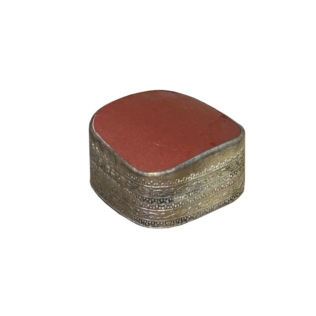 This is a handmade pewter box in an irregular shape with an old white base color oriental brick red porcelain part inset...