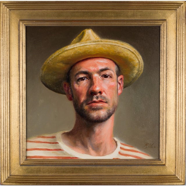 This self-portrait features the artist wearing a straw hat and a striped shirt, capturing a moment of introspection. The...