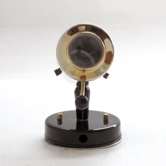 Brass and black enameled wall lights by Jacques Biny for Lita, with magnifying lens, handle to adjust angle and direction,...