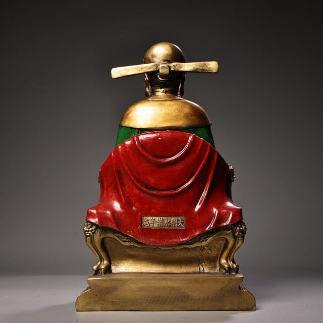 This is a substantial antique polychrome bronze sculpture depicting Wenchang Dijun, a revered Taoist deity associated with...
