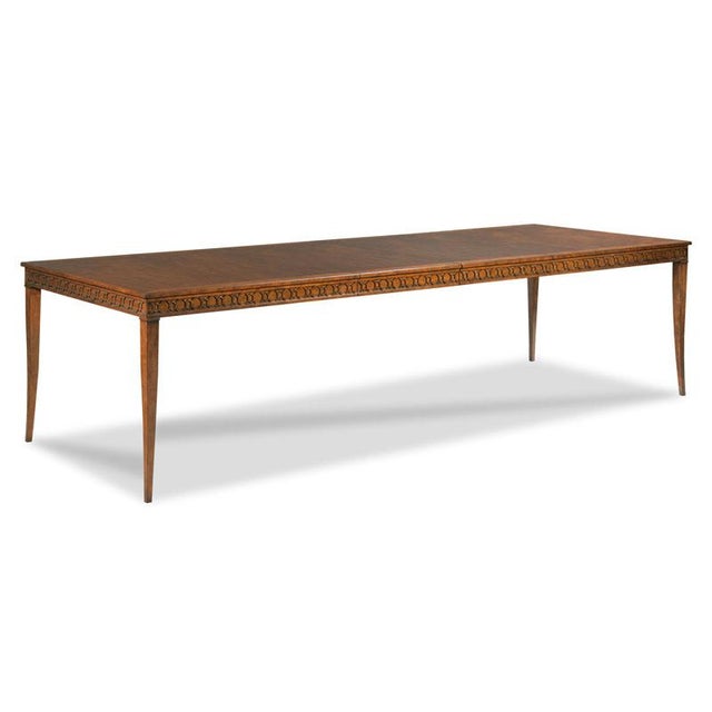 A rectangular cherry veneered top rests over fretwork apron rails elevated on tapering flared legs. Specifications 76"W x...