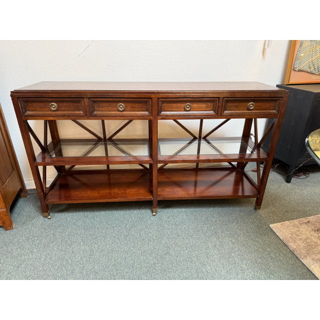 Design Plus Gallery presents a Provencal Style Console Table from Sunrise Home. The console table has an auburn stain to...