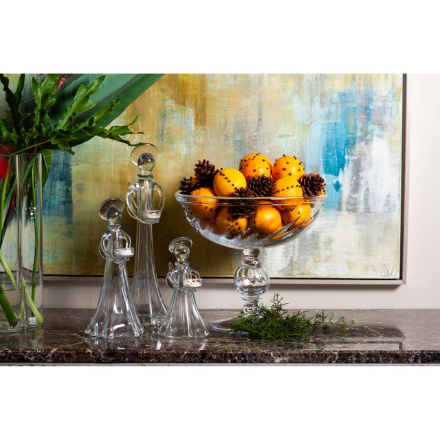 This is a beautiful large handmade glass compote. The bowl is slightly optic and rests on a decorative stem with a glass...